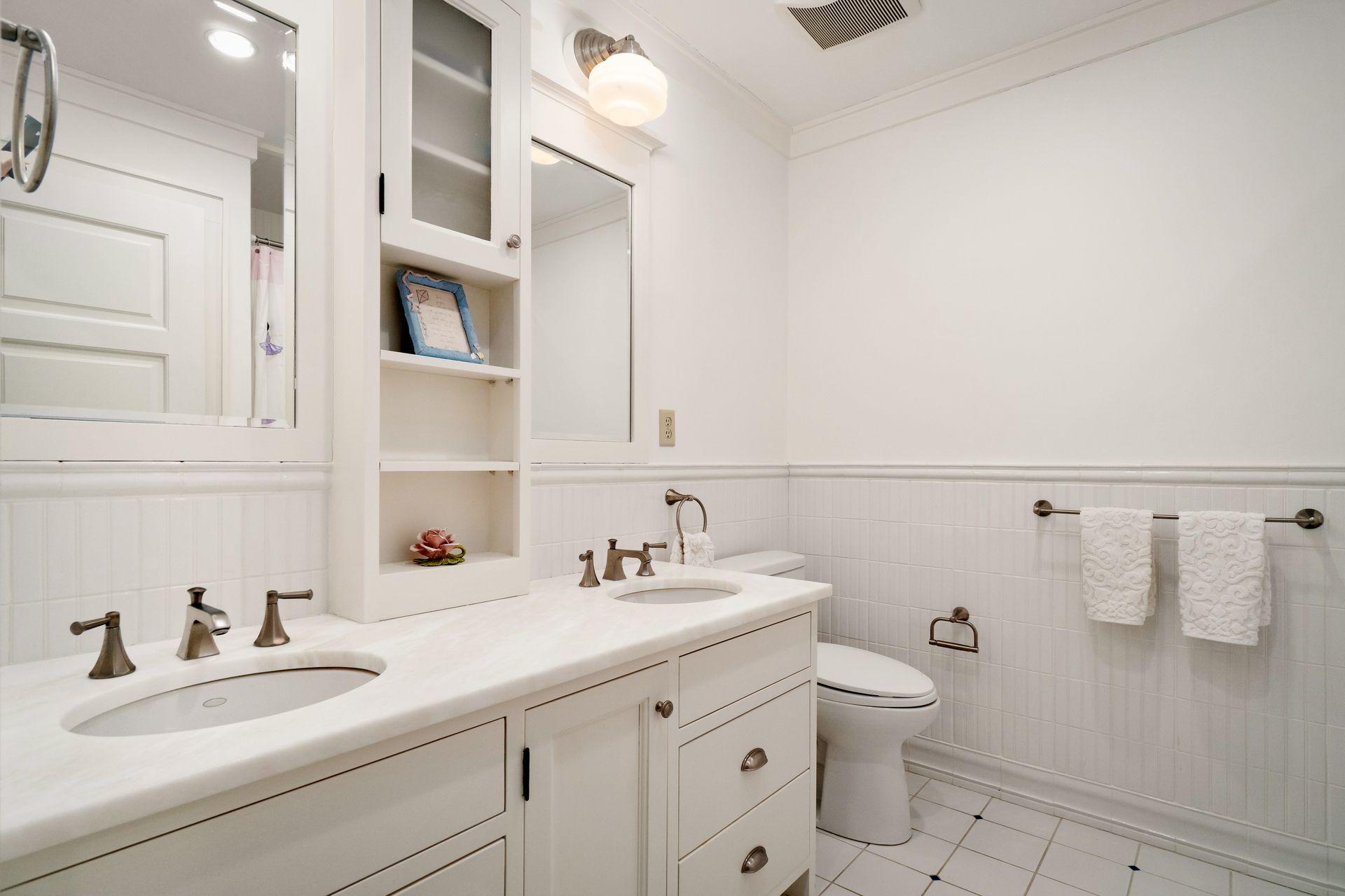 57 Rilling Ridge New Canaan, CT 06840 - Photo 36 of 68 a bathroom with a sink a toilet and mirror