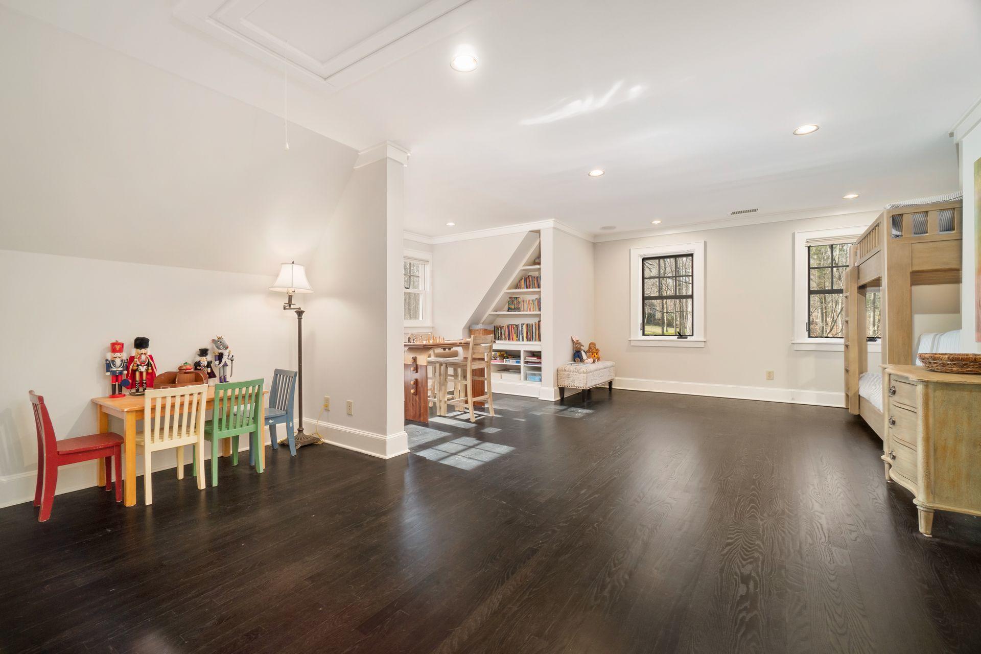 57 Rilling Ridge New Canaan, CT 06840 - Photo 39 of 68 a view of a living room and dining room with wooden floor
