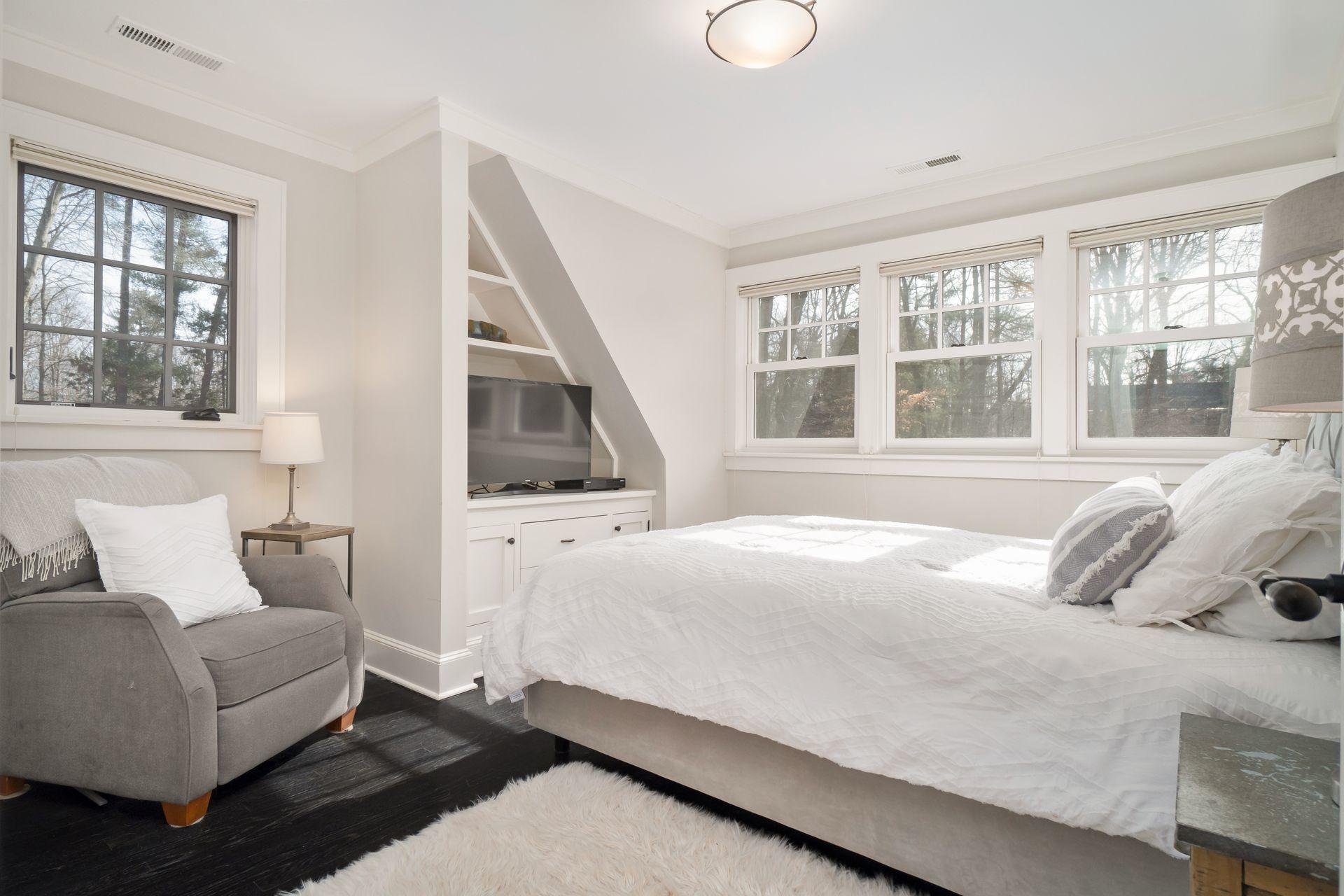 57 Rilling Ridge New Canaan, CT 06840 - Photo 42 of 68 a bedroom with a bed wooden floor and window