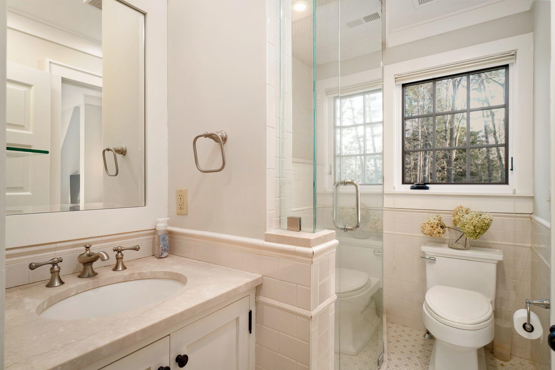 57 Rilling Ridge New Canaan, CT 06840 - Photo 43 of 68 a bathroom with a granite countertop toilet sink and mirror