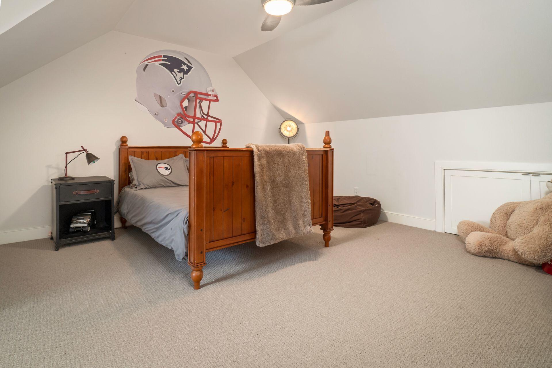 57 Rilling Ridge New Canaan, CT 06840 - Photo 45 of 68 a bedroom with a bed and a chandelier