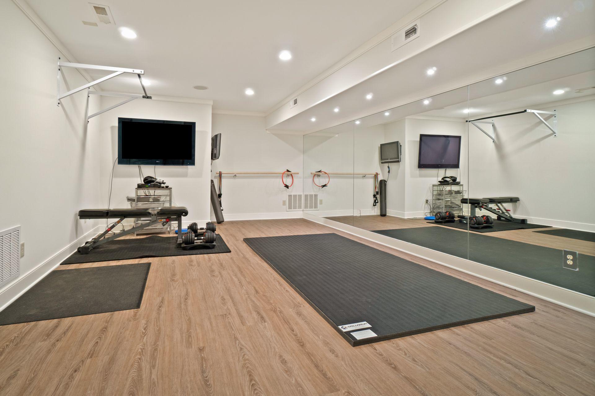 57 Rilling Ridge New Canaan, CT 06840 - Photo 49 of 68 a living room with stainless steel appliances kitchen island furniture a flat screen tv and a sink