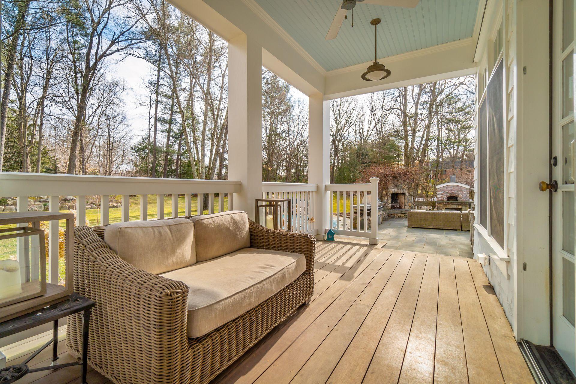 57 Rilling Ridge New Canaan, CT 06840 - Photo 54 of 68 a balcony with wooden floor and outdoor seating