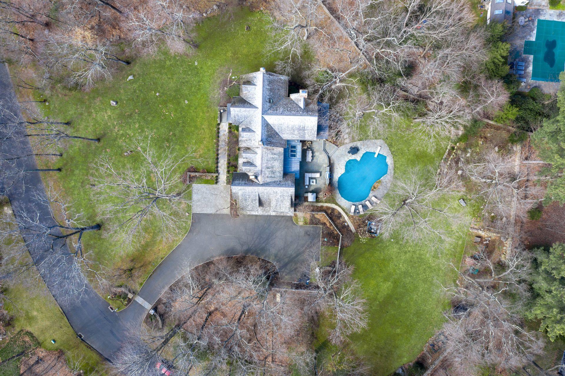 57 Rilling Ridge New Canaan, CT 06840 - Photo 65 of 68 a backyard of a house with outdoor seating