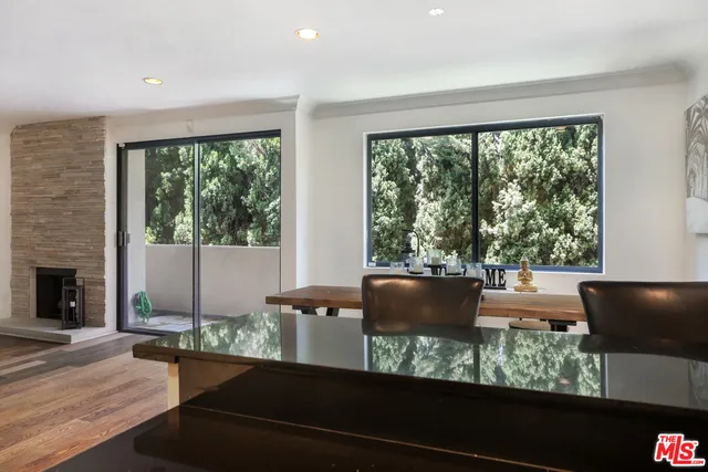 a view of a floor to ceiling window and wooden floor