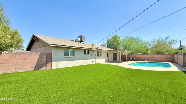 a front view of house with yard and green space