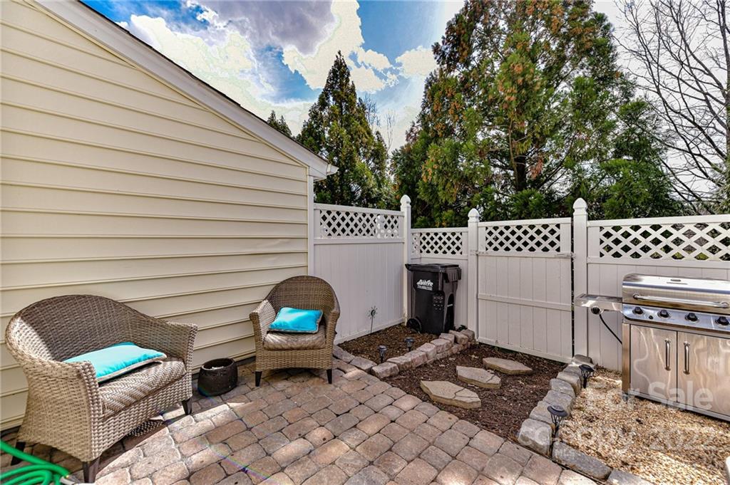 122 Chimney Rock Lane Fort Mill, SC 29708 - Photo 23 of 27 a view of a chairs and table in backyard
