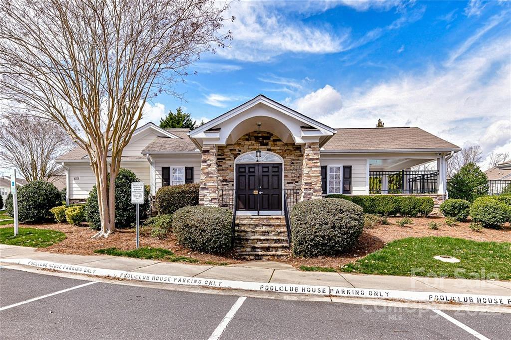 122 Chimney Rock Lane Fort Mill, SC 29708 - Photo 24 of 27 a front view of a house with a garden