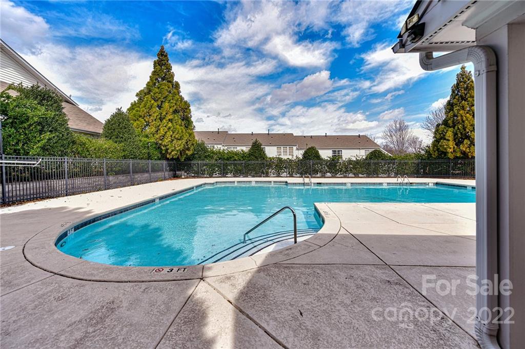 122 Chimney Rock Lane Fort Mill, SC 29708 - Photo 26 of 27 a view of a swimming pool with a lounge chair