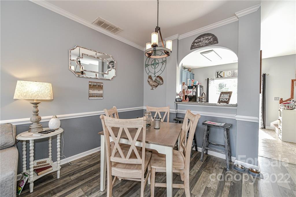 122 Chimney Rock Lane Fort Mill, SC 29708 - Photo 9 of 27 a view of a dining room with furniture and chandelier