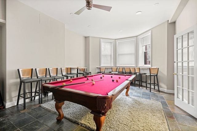 a kitchen with stainless steel appliances granite countertop a stove and a sink