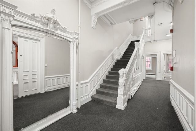 a view of staircase with white walls and stair