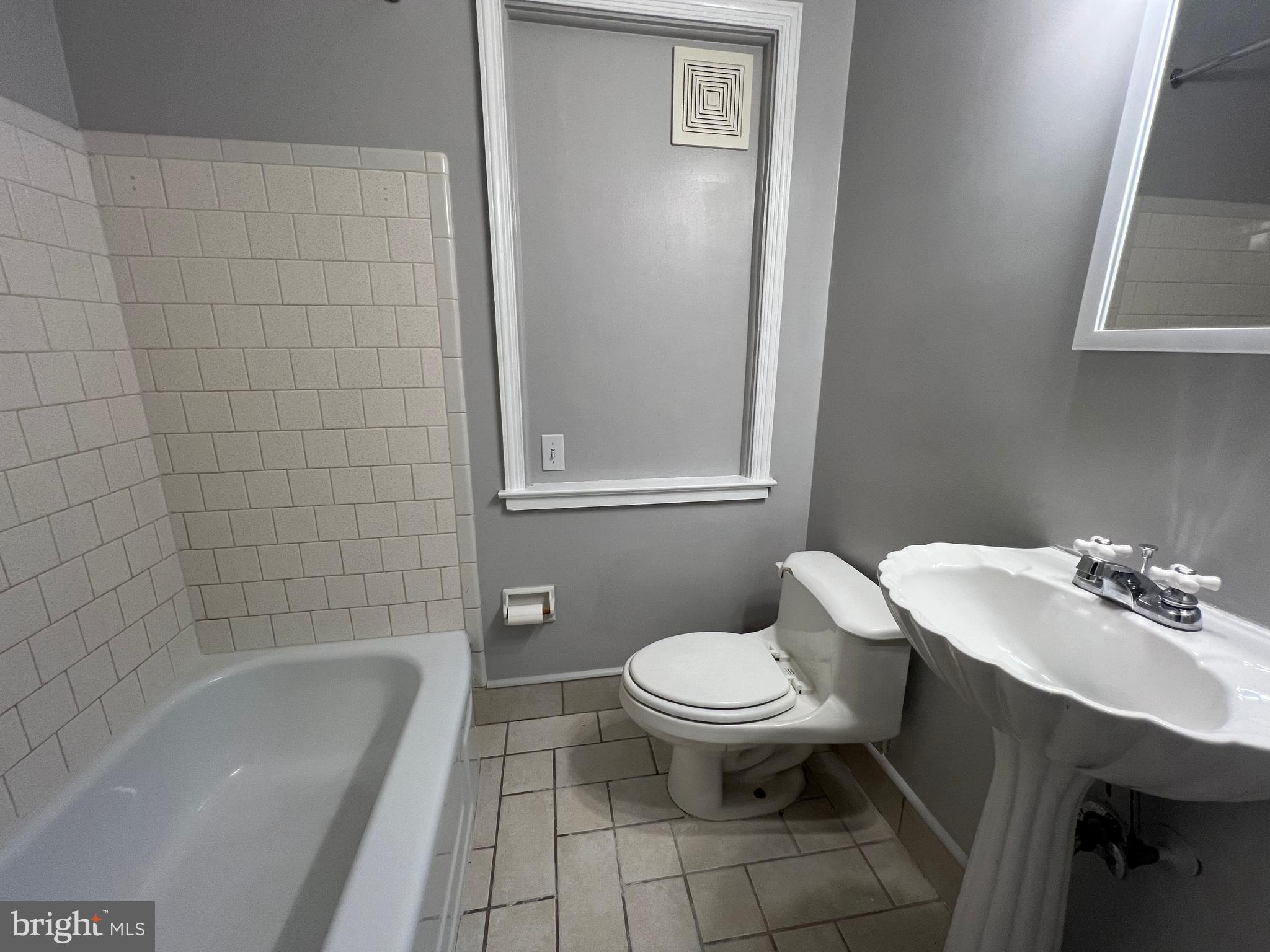 401 Imla Street Baltimore, MD 21224 - Photo 20 of 28 a bathroom with a sink toilet and shower