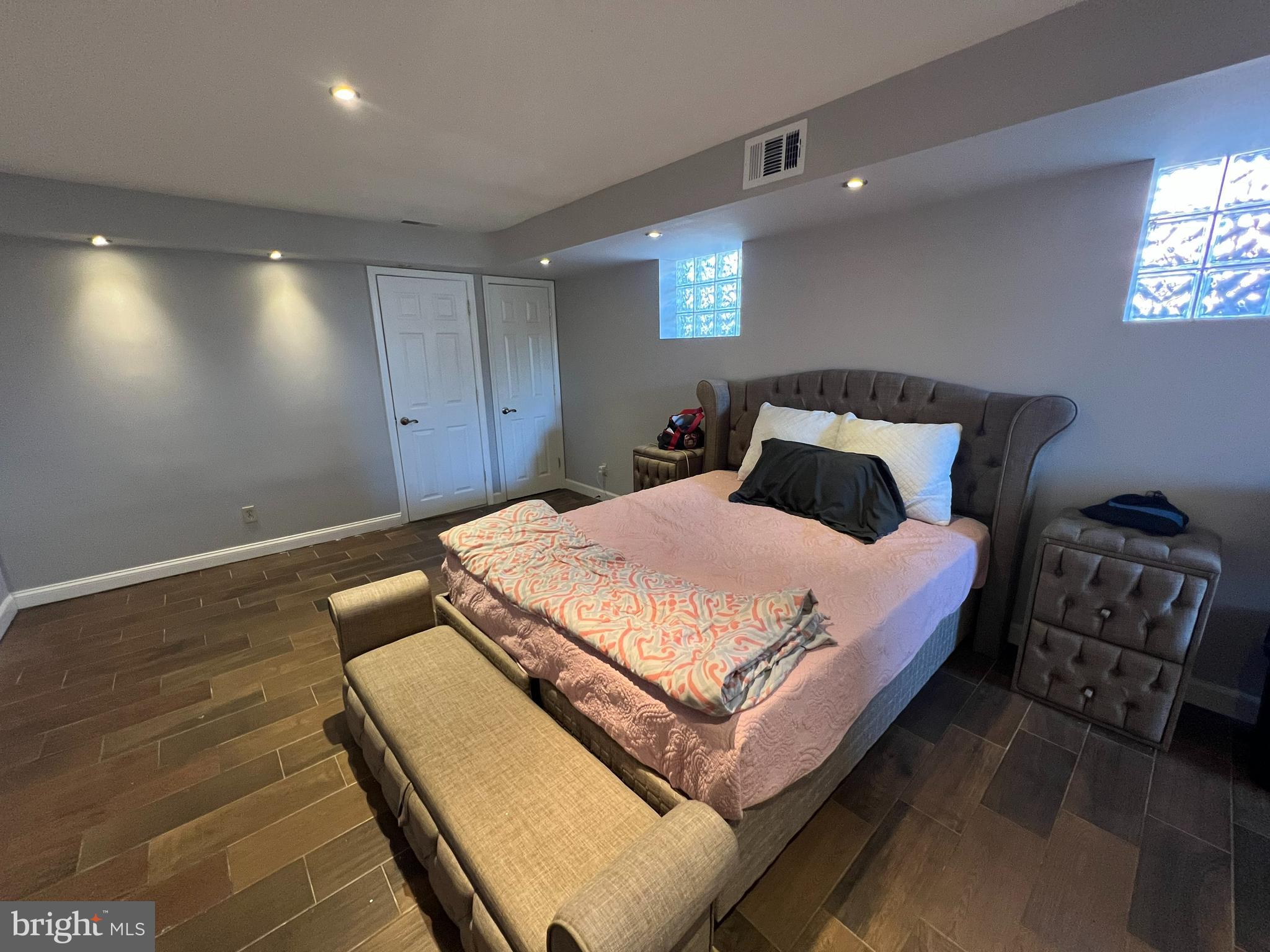 401 Imla Street Baltimore, MD 21224 - Photo 21 of 28 a bedroom with a bed and a night stand