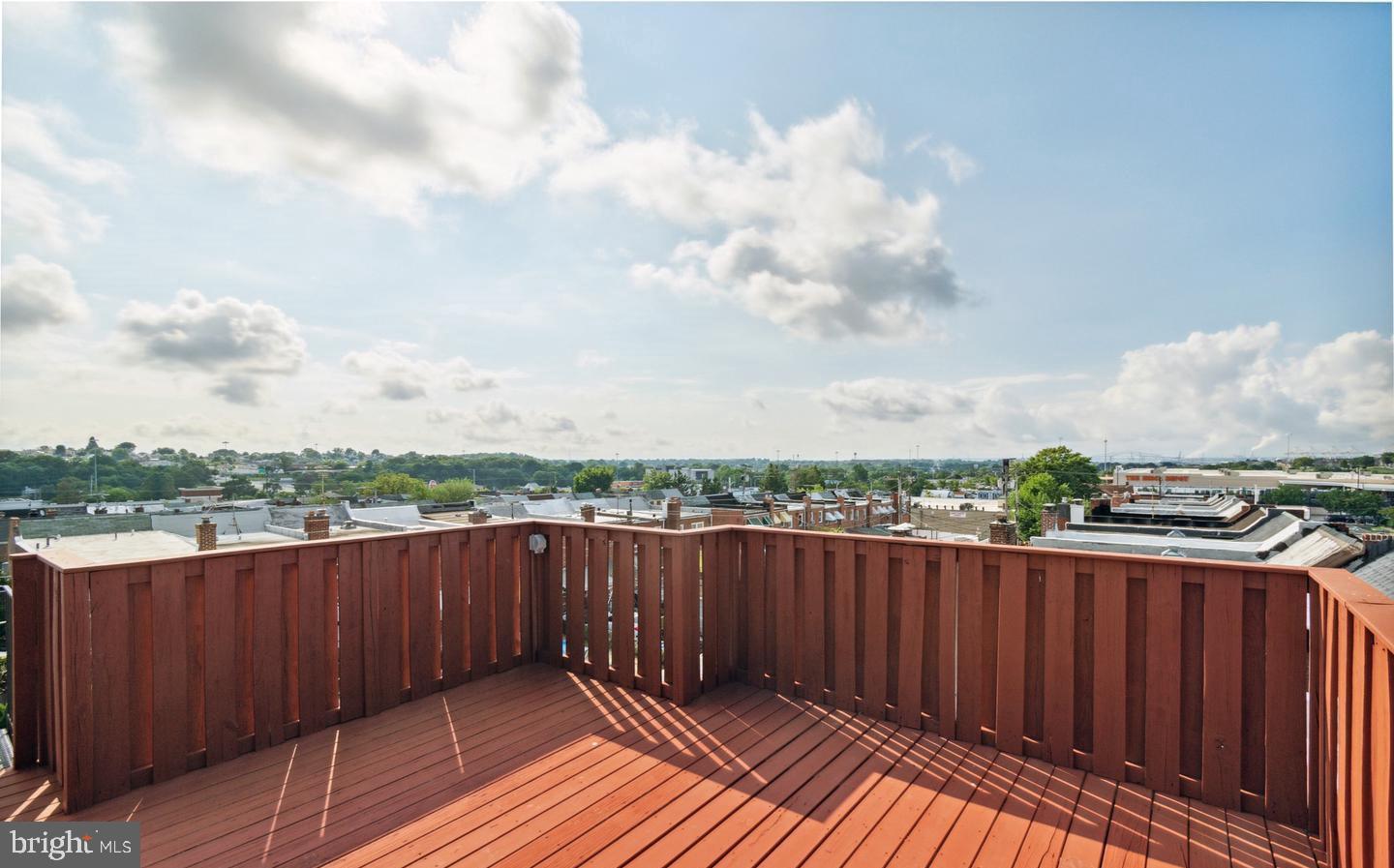 401 Imla Street Baltimore, MD 21224 - Photo 27 of 28 a view of a balcony with wooden fence