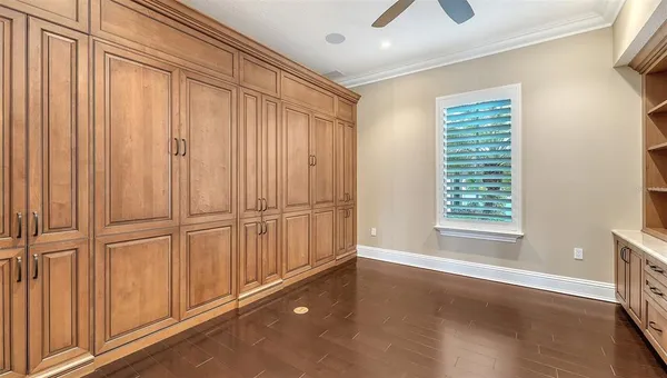 a living room with lots of furniture and chandelier