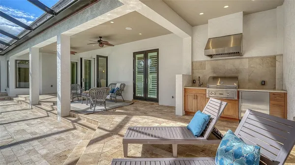 an aerial view of a residential houses with outdoor space and street view