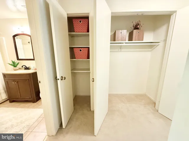 a view of entryway with a hall and wooden floor