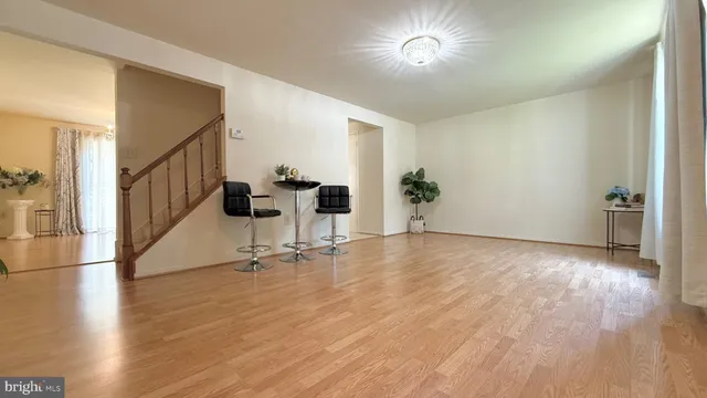 a view of livingroom with furniture wooden floor and windows