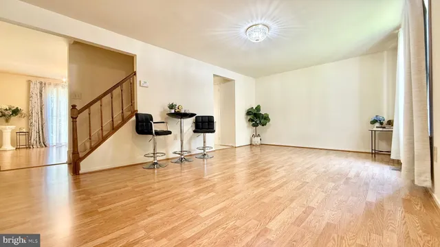 a view of a dining room with furniture and window