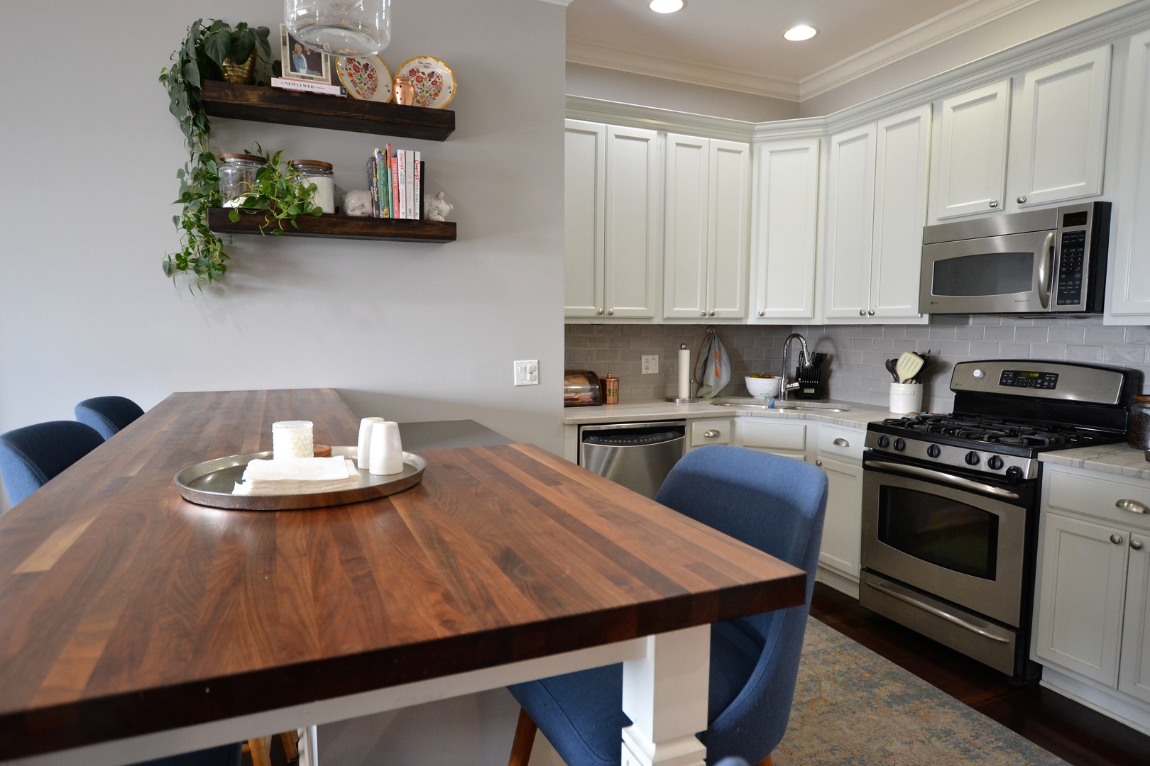 2900 West Irving Park Road, Unit 404 Chicago, IL 60618 - Photo 11 of 26 a kitchen with a stove a sink and cabinets