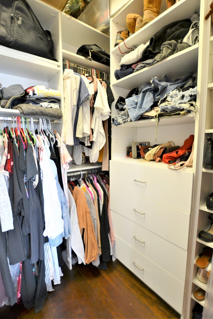 2900 West Irving Park Road, Unit 404 Chicago, IL 60618 - Photo 16 of 26 a view of walk in closet with clothes and shoes