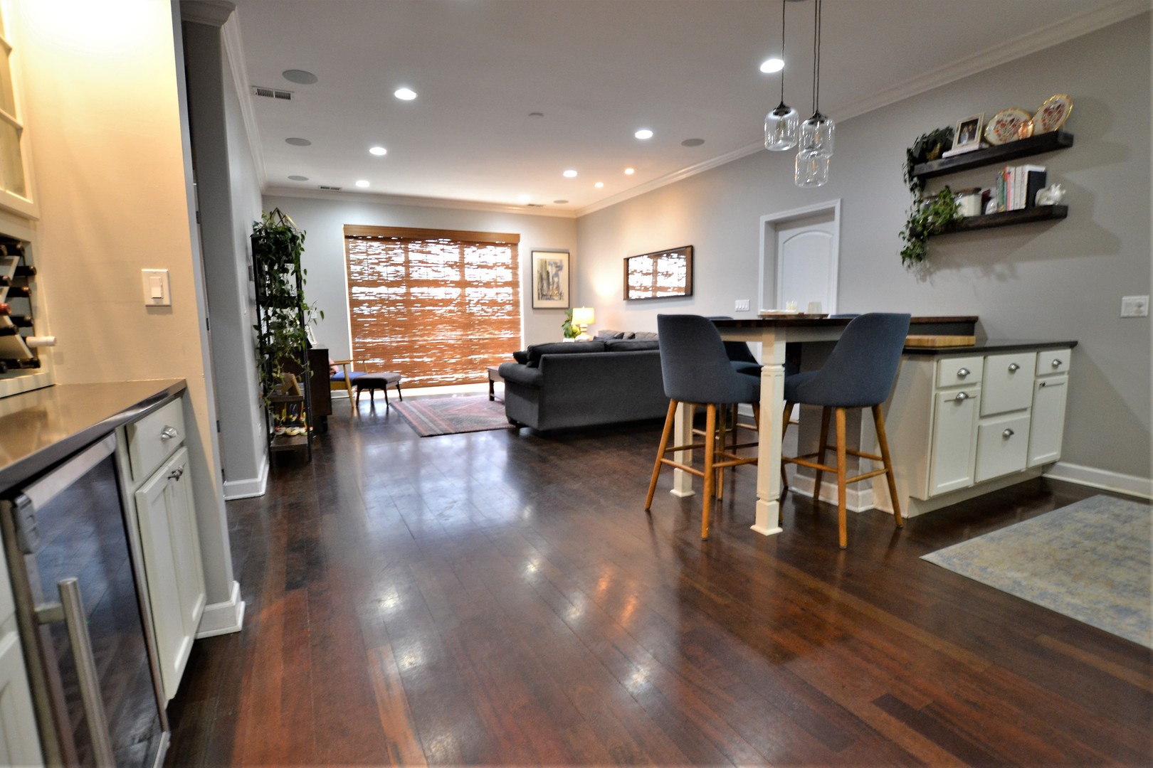 2900 West Irving Park Road, Unit 404 Chicago, IL 60618 - Photo 3 of 26 a living room with furniture and a wooden floor