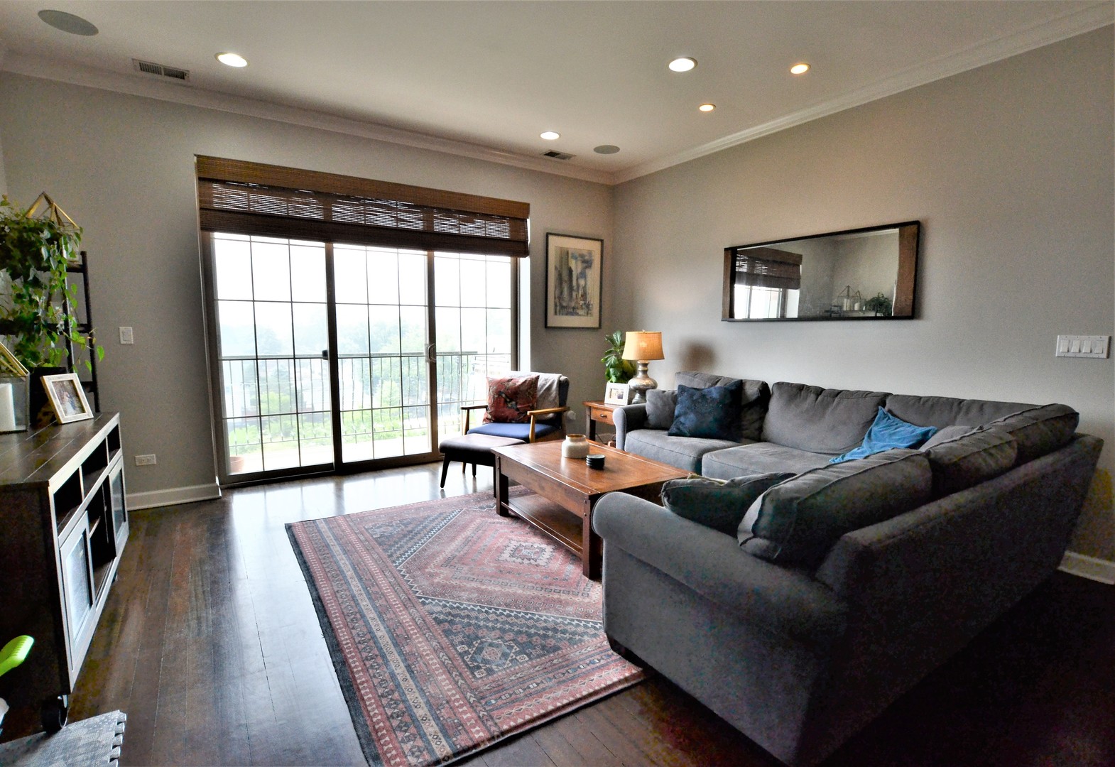 2900 West Irving Park Road, Unit 404 Chicago, IL 60618 - Photo 4 of 26 a living room with furniture and a flat screen tv