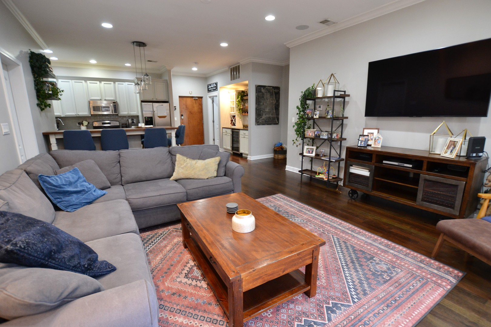 2900 West Irving Park Road, Unit 404 Chicago, IL 60618 - Photo 5 of 26 a living room with furniture and a flat screen tv