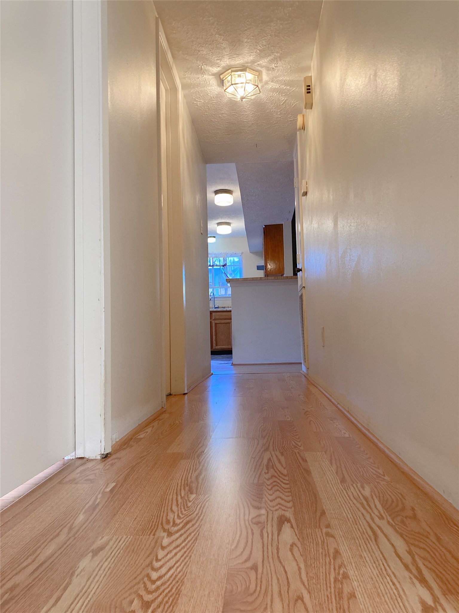 19518 Munsey Court Katy, TX 77449 - Photo 16 of 45 a view of empty room with wooden floor