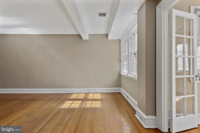 a view of a room with wooden floor and small space