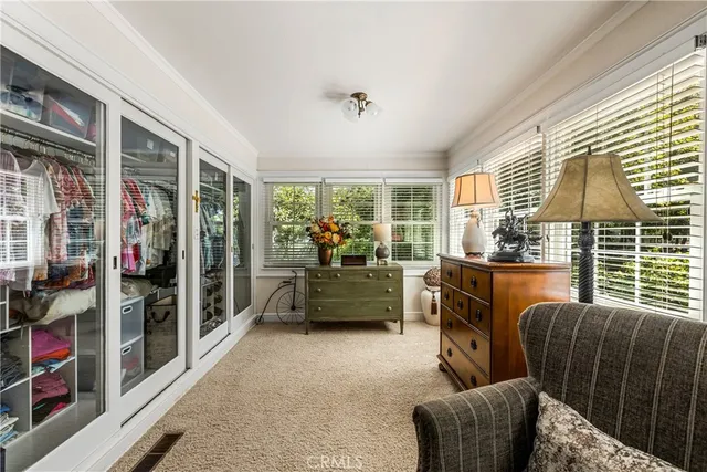 a bedroom with furniture and a window