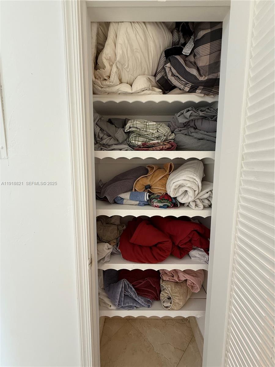 300 Northwest 42nd Street Boca Raton, FL 33431 - Photo 18 of 32 a room with a book shelf