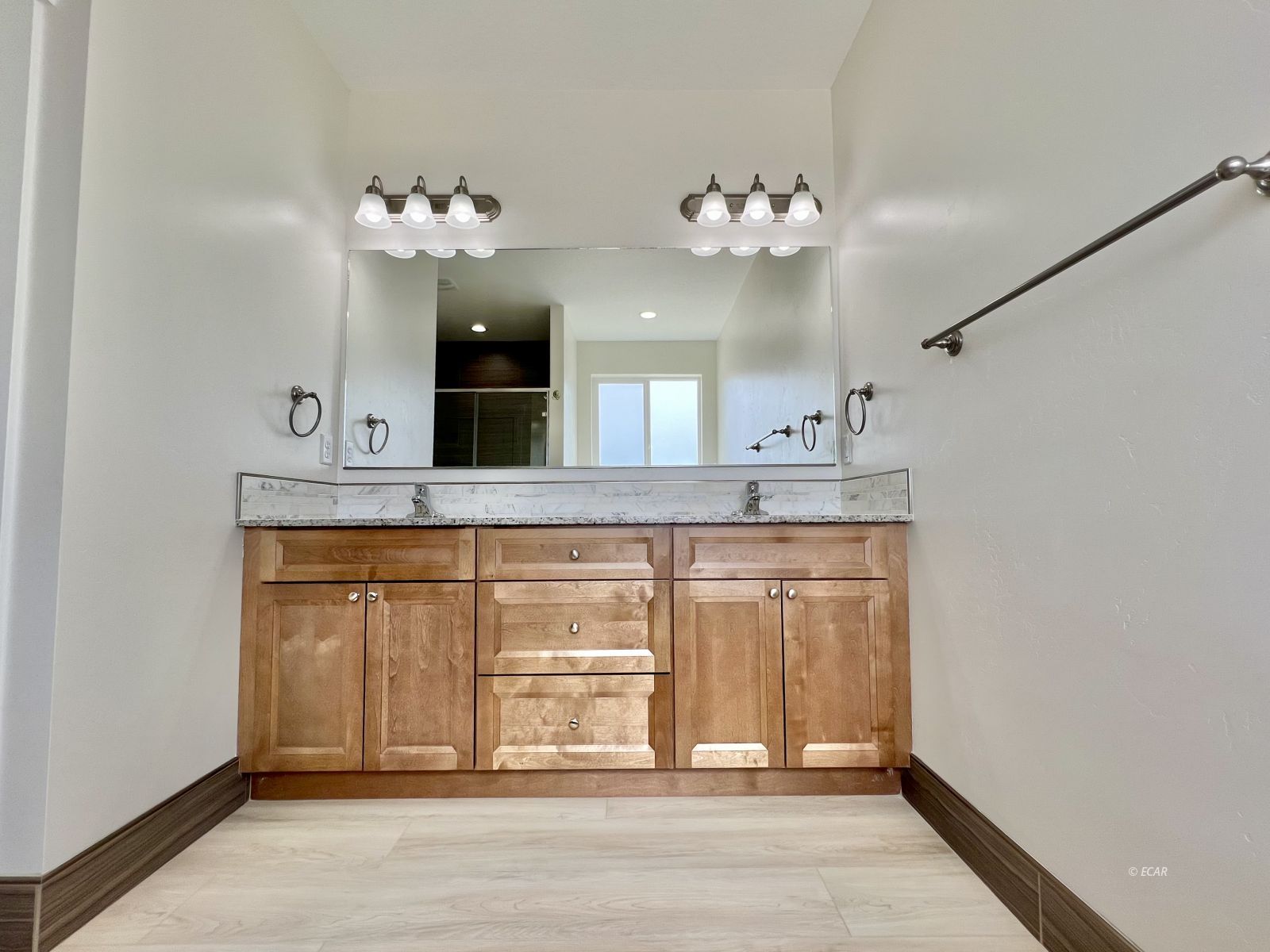 142 Diamond Rdg Drive Spring Creek, NV 89815 - Photo 29 of 36 a bathroom with a sink vanity and a mirror