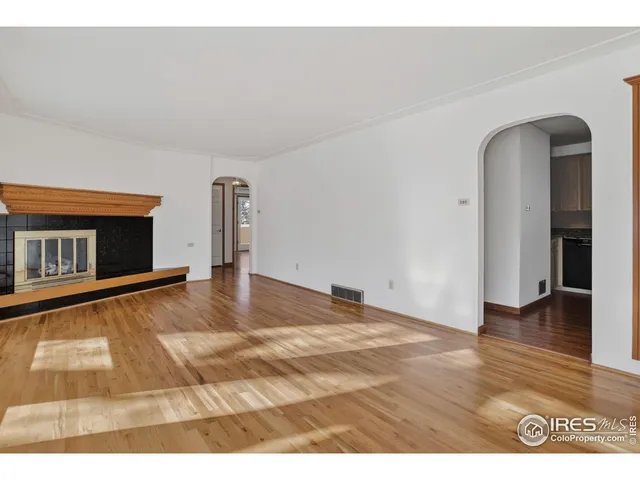 a view of a livingroom with wooden floor