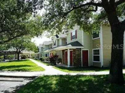 a view of a house with a yard