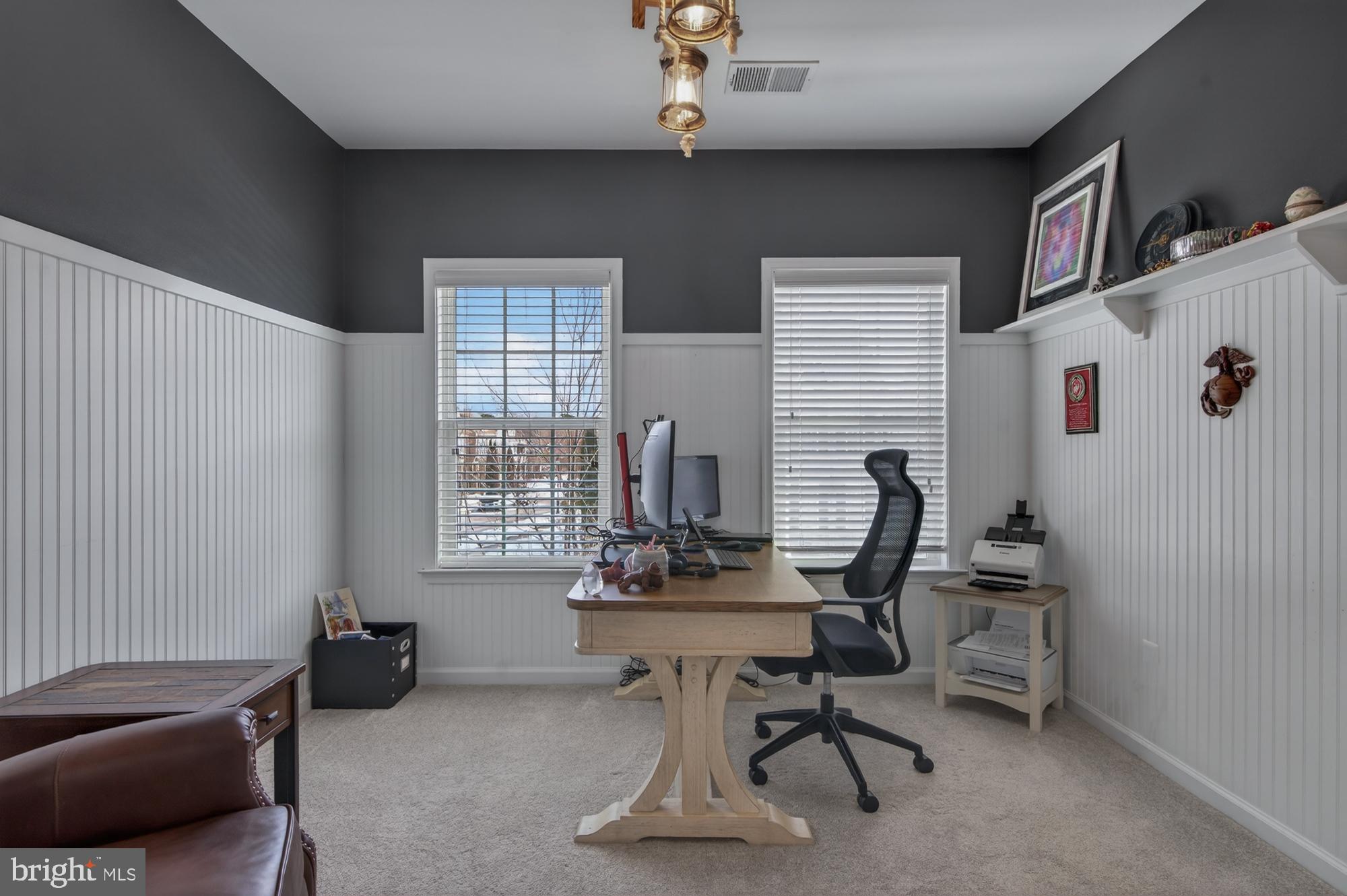 1317 Yourtee Spring Drive Brunswick, MD 21716 - Photo 35 of 73 a view of a workspace with furniture and a window