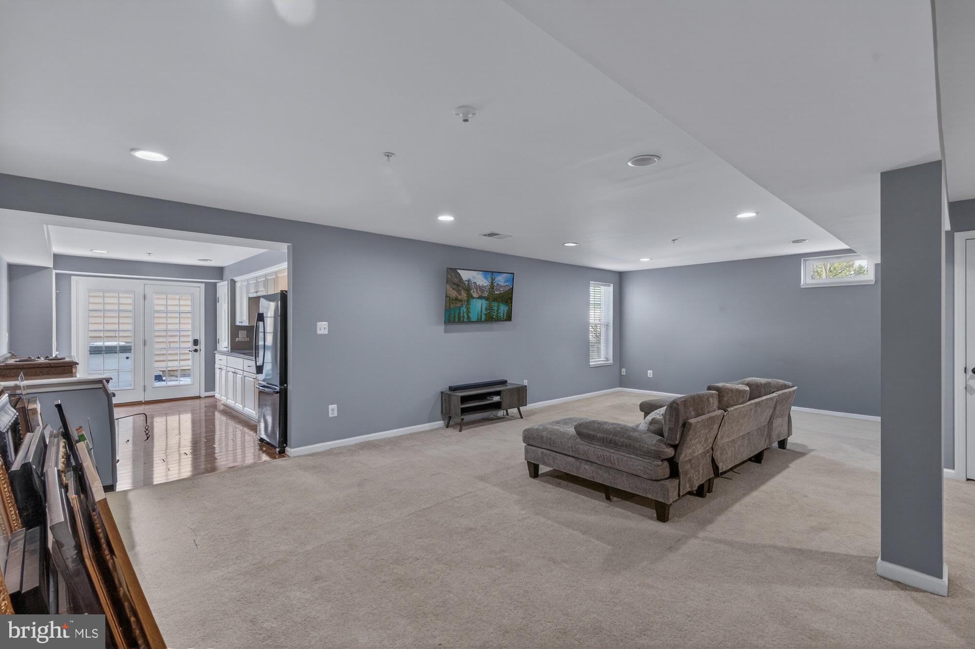 1317 Yourtee Spring Drive Brunswick, MD 21716 - Photo 43 of 73 a living room with furniture gym equipment and a table