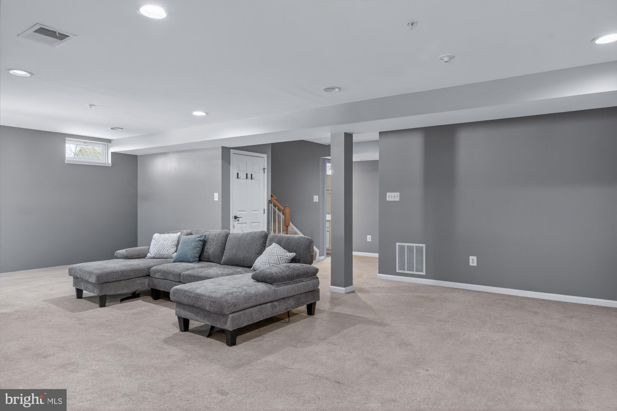 1317 Yourtee Spring Drive Brunswick, MD 21716 - Photo 45 of 73 a living room with furniture and a couch