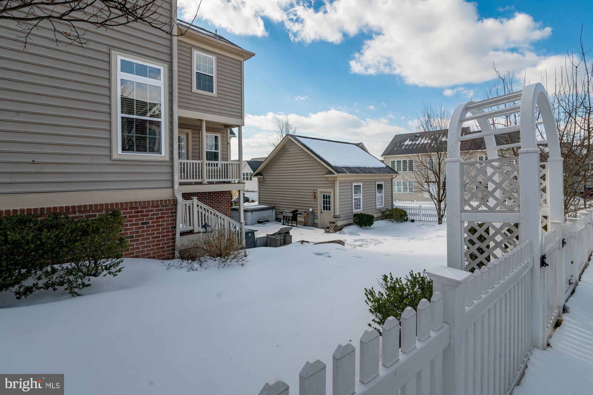 1317 Yourtee Spring Drive Brunswick, MD 21716 - Photo 53 of 73 a view of a house with backyard and sitting area