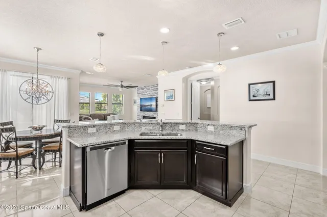 a kitchen with a sink and stove