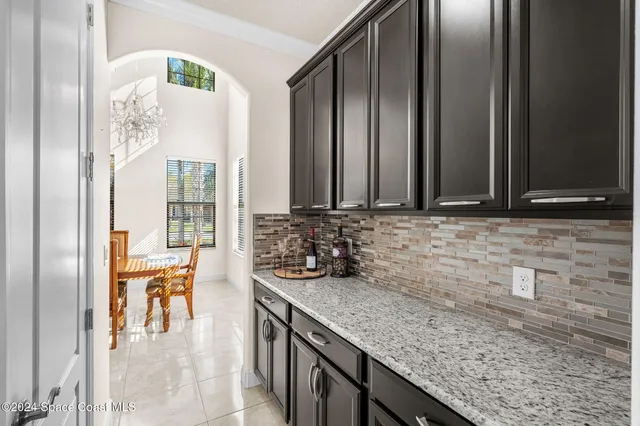 a kitchen with stainless steel appliances granite countertop a sink and a granite counter tops