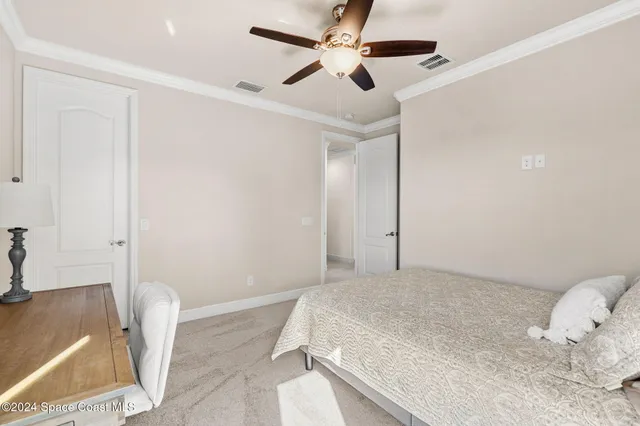 a view of a swimming pool with a garden and a patio