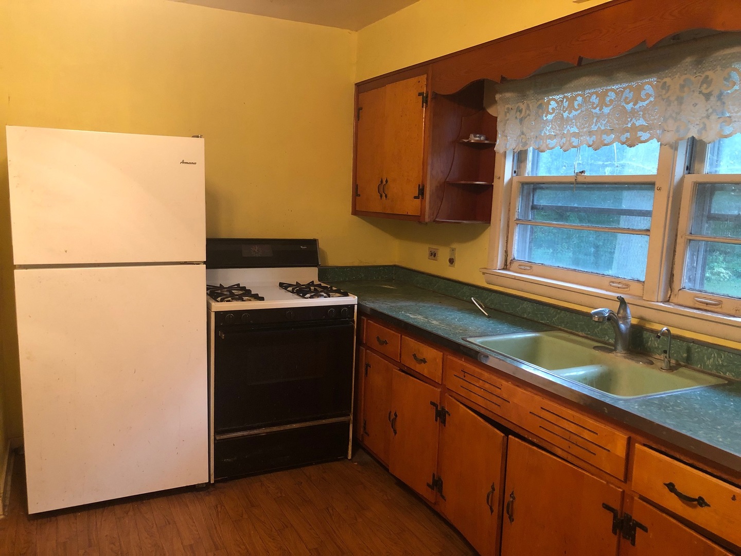 N344 Willow Road Wheaton, IL 60187 - Photo 5 of 11 a kitchen with a refrigerator and a sink