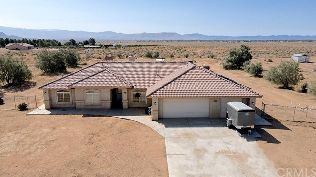 22437 S Road Apple Valley, CA 92307 - Photo 1 of 1 a view of a house with a yard
