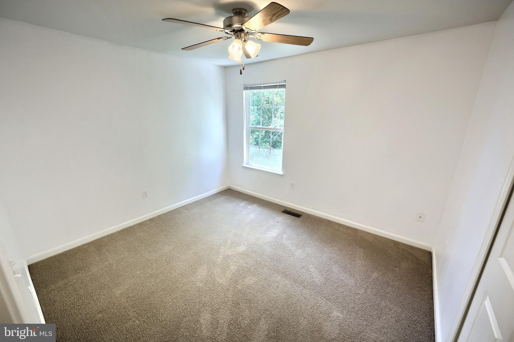 425 Lakeview Drive Spring Grove, PA 17362 - Photo 29 of 51 an empty room with a window and a fan
