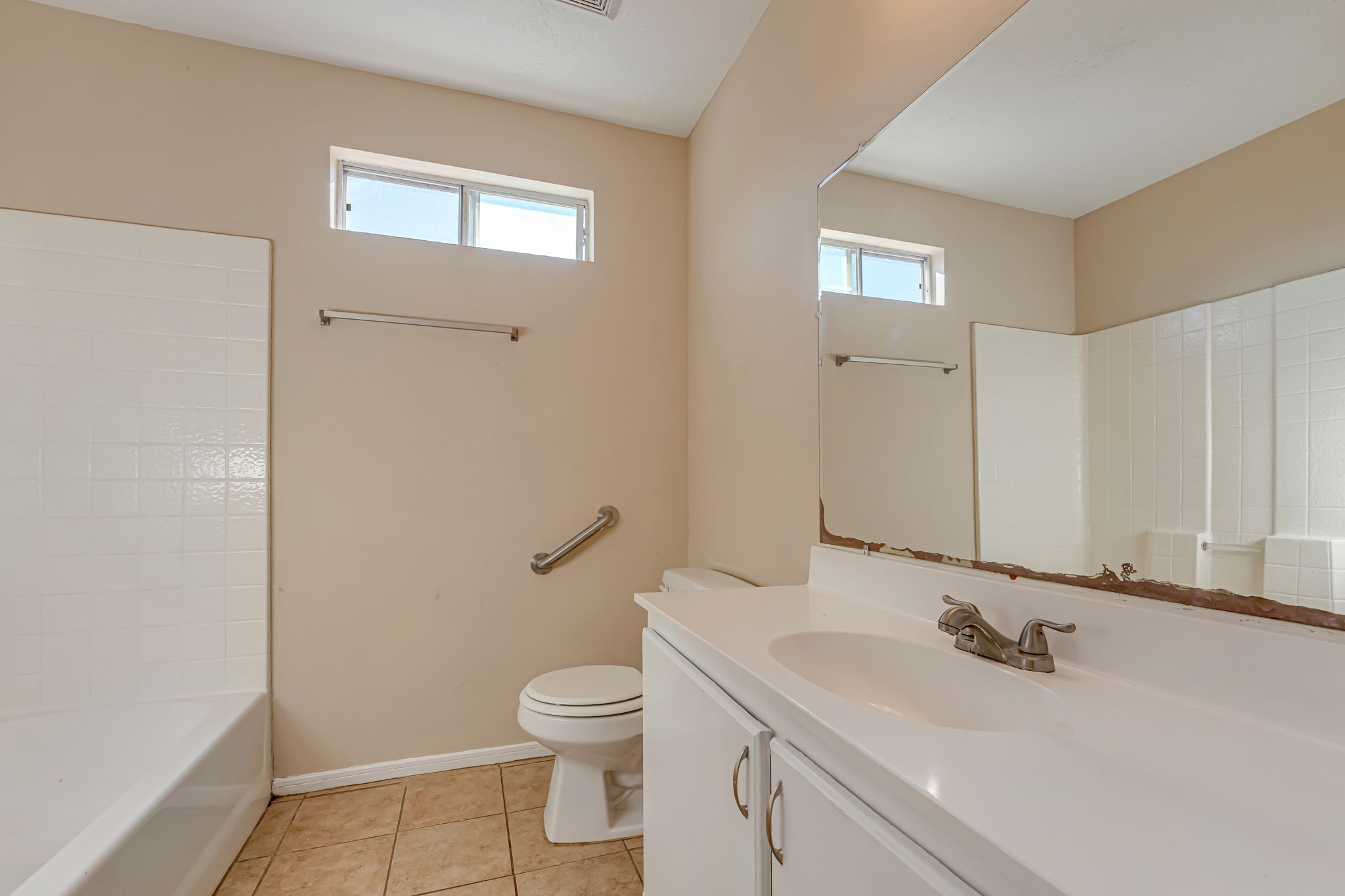 914 Chapwood Court Spring, TX 77373 - Photo 18 of 22 a bathroom with a sink a toilet and a mirror