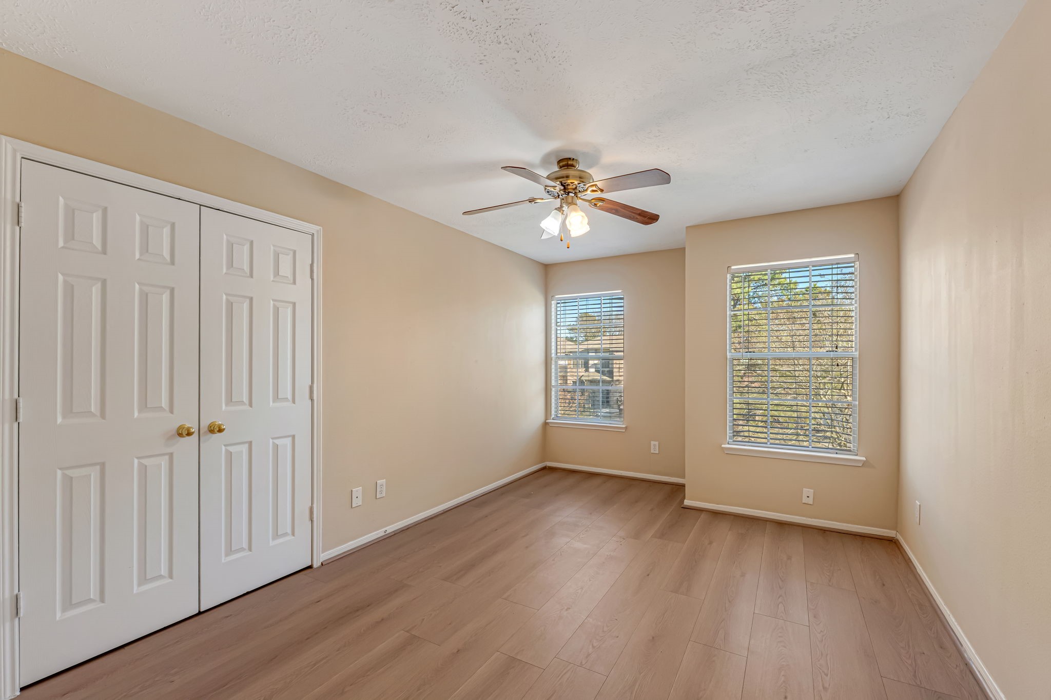 914 Chapwood Court Spring, TX 77373 - Photo 19 of 22 a view of an empty room with a window and wooden floor
