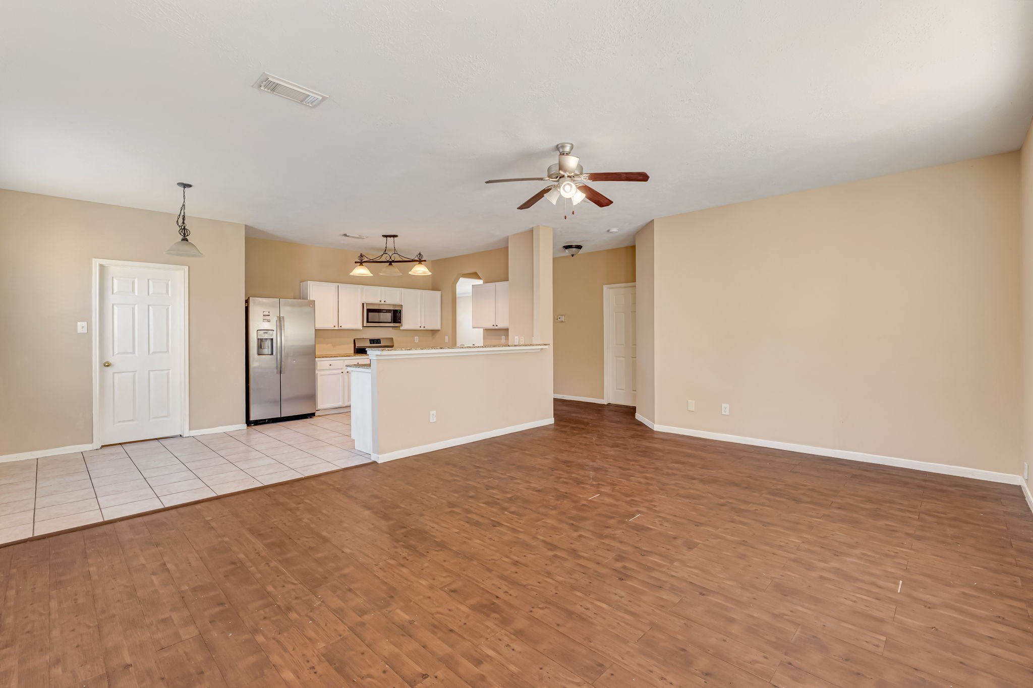 914 Chapwood Court Spring, TX 77373 - Photo 5 of 22 a view of a kitchen with a sink and a refrigerator