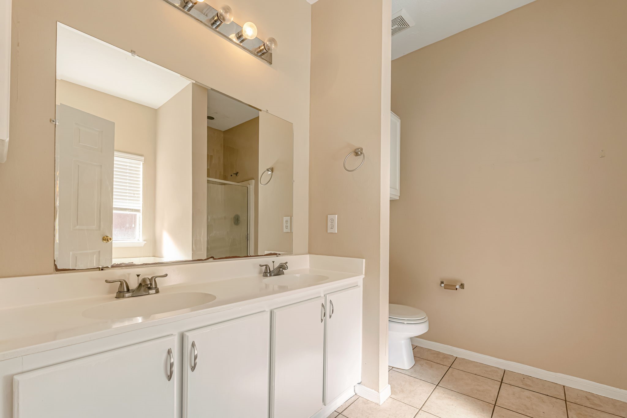 914 Chapwood Court Spring, TX 77373 - Photo 10 of 22 a bathroom with a sink a toilet and a mirror